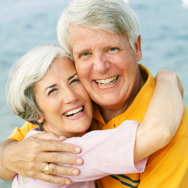 The elderly couple happily smiling